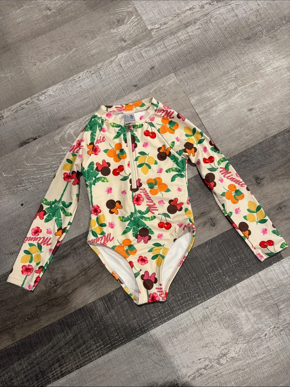 NWOT Kids Disney Cream One-Piece Rash Guard with Multicolor Fruit & Floral Print